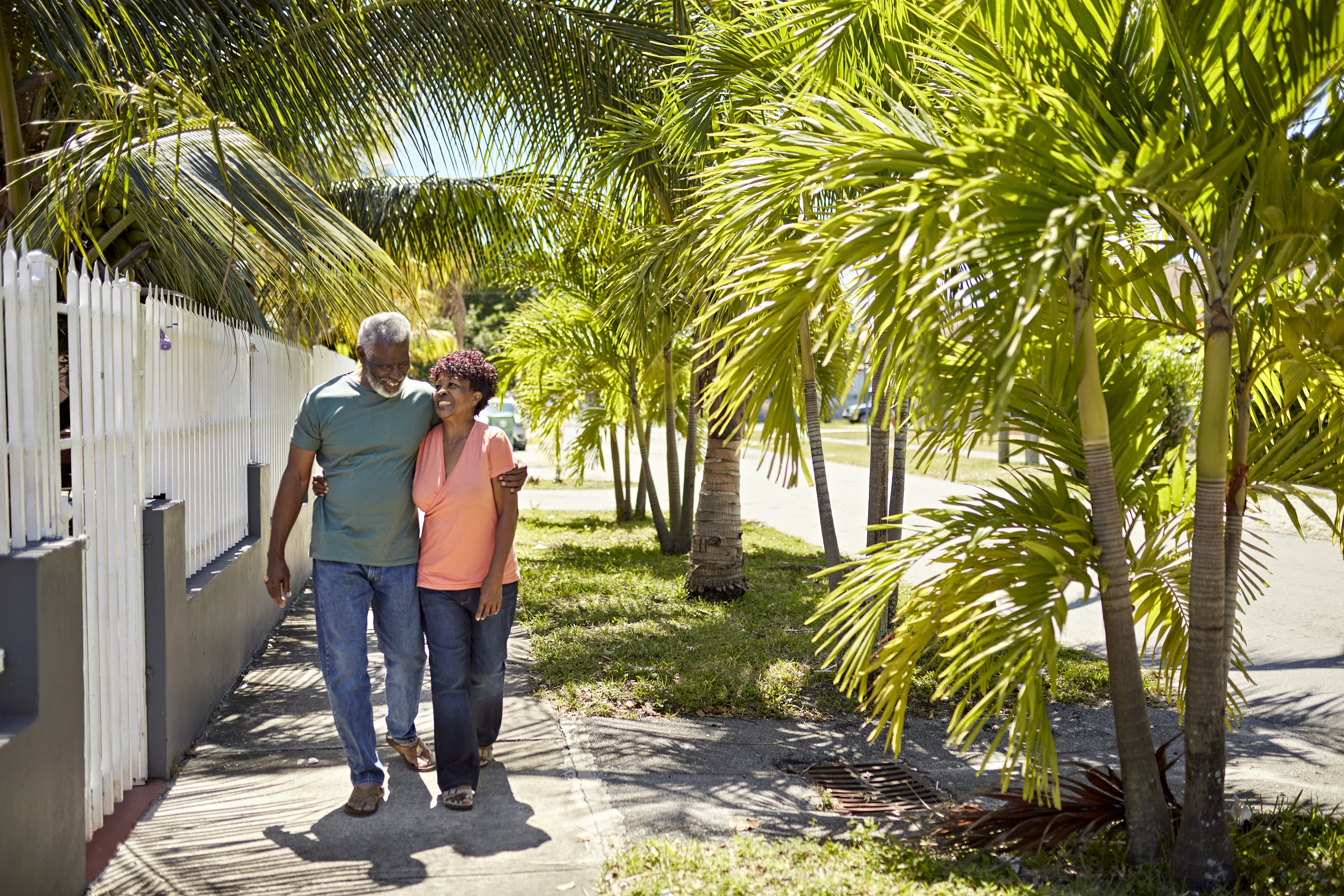 Older couple walking in neighborhood